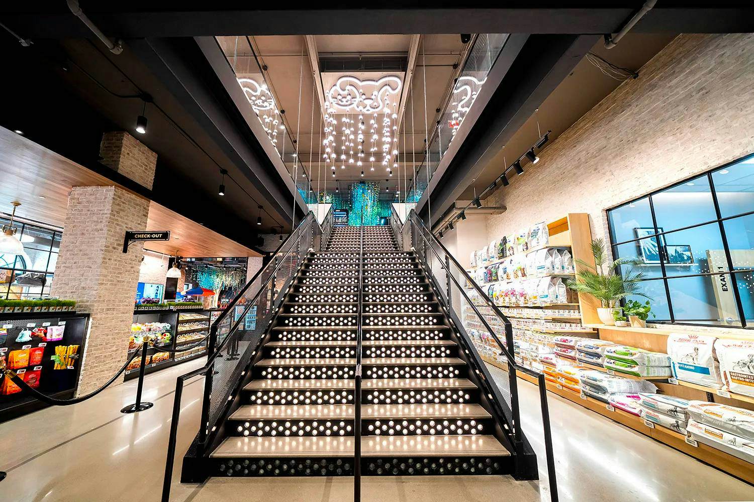 The staircase inside Petco’s NYC flagship has hundreds of lights embedded in it. 