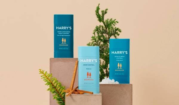 Three Harry's deodorant products standing on shelves