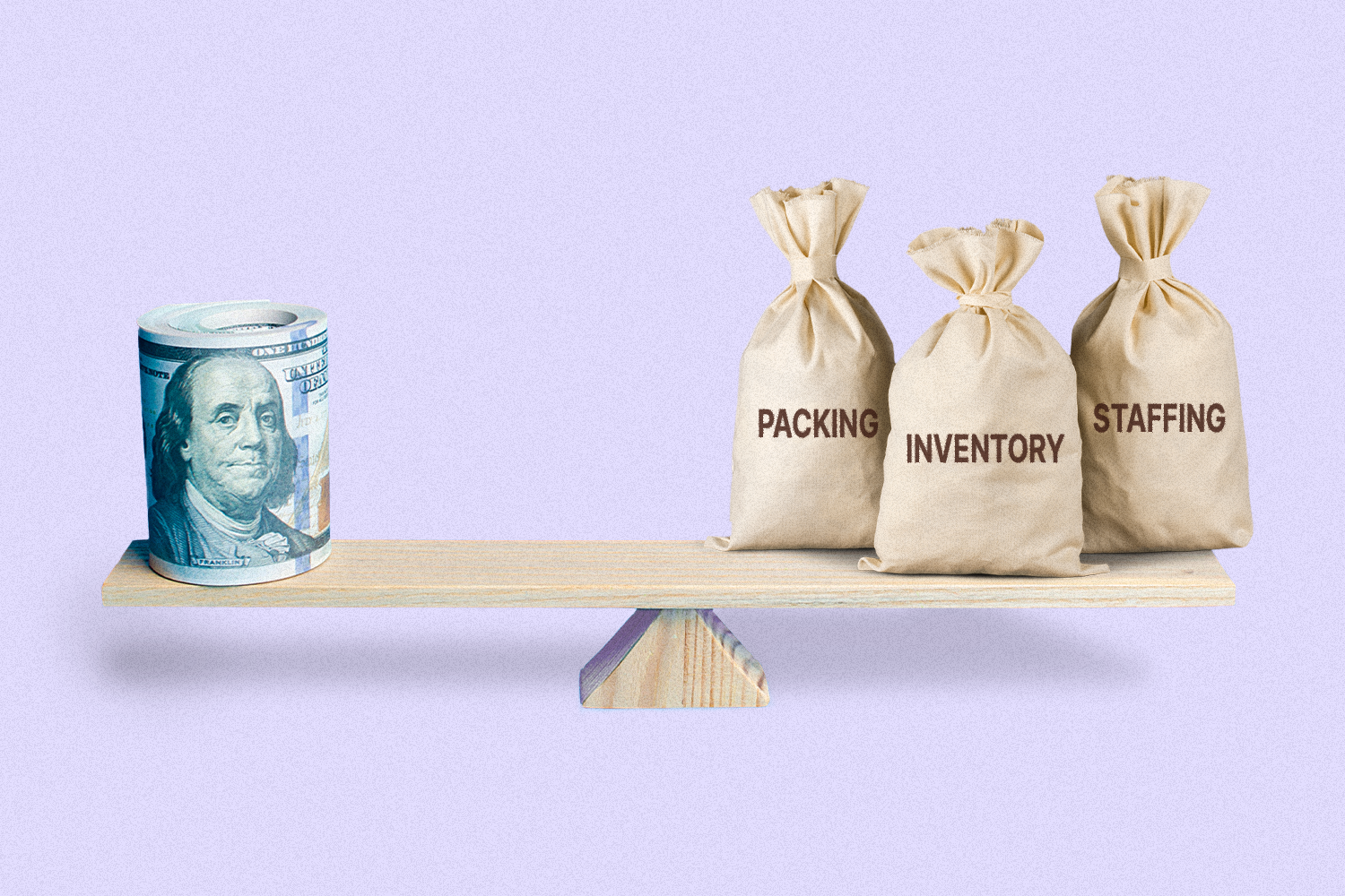 A seesaw with a rolled up stack of money on one side and three bags individually labeled "Packing," "Inventory," and "Staffing" on the other