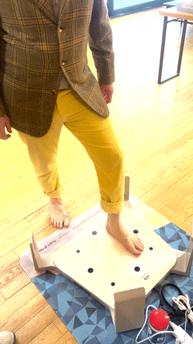 A gif shows the author stepping on a Volumental device that created a 3D image of his feet. The  gif also shows a Fleet Feet executive displaying the scan on a laptop. 