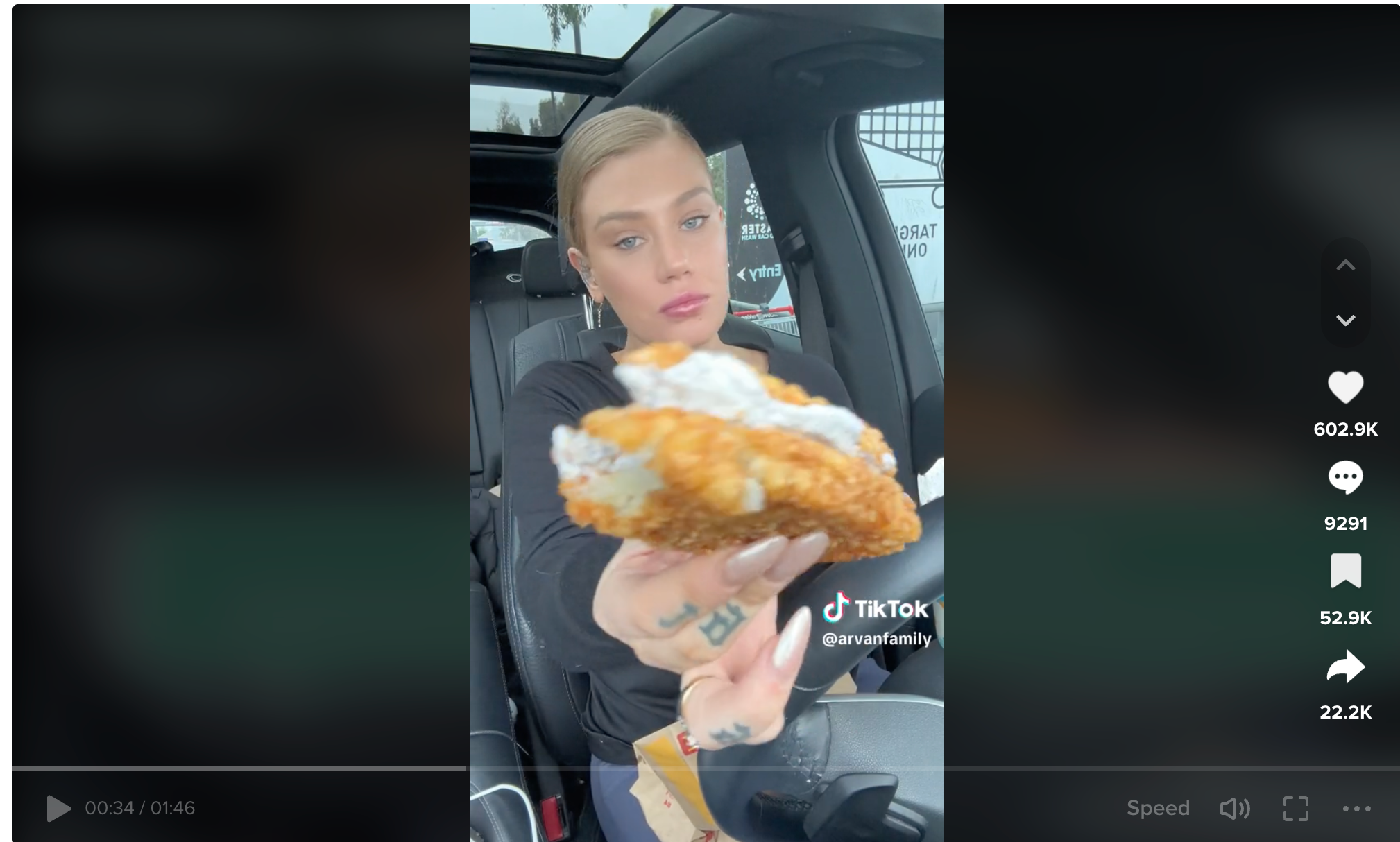 A TikTok video features a woman showing a sandwich she's eating made from two McDonald's hash browns and an Oreo McFlurry.