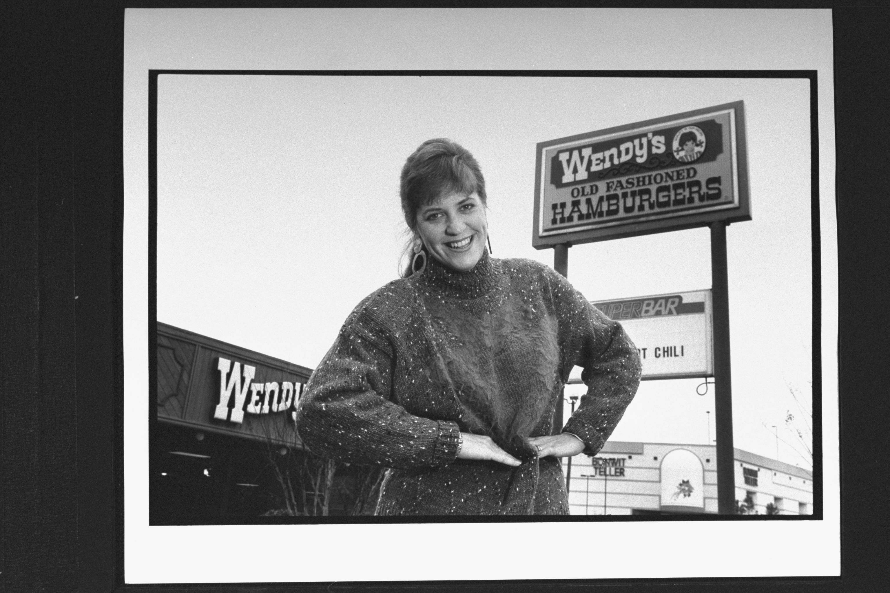 Wendy Thomas in front of a Wendy's