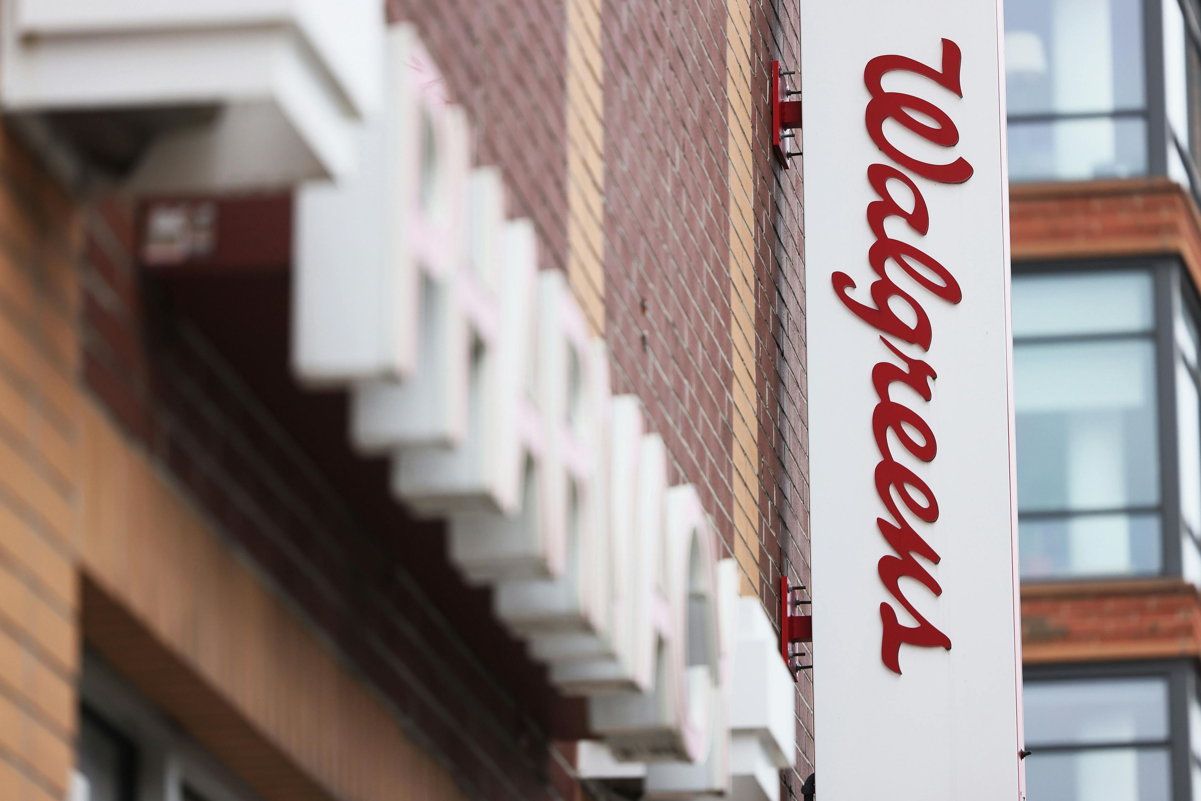A white Walgreens sign with red writing