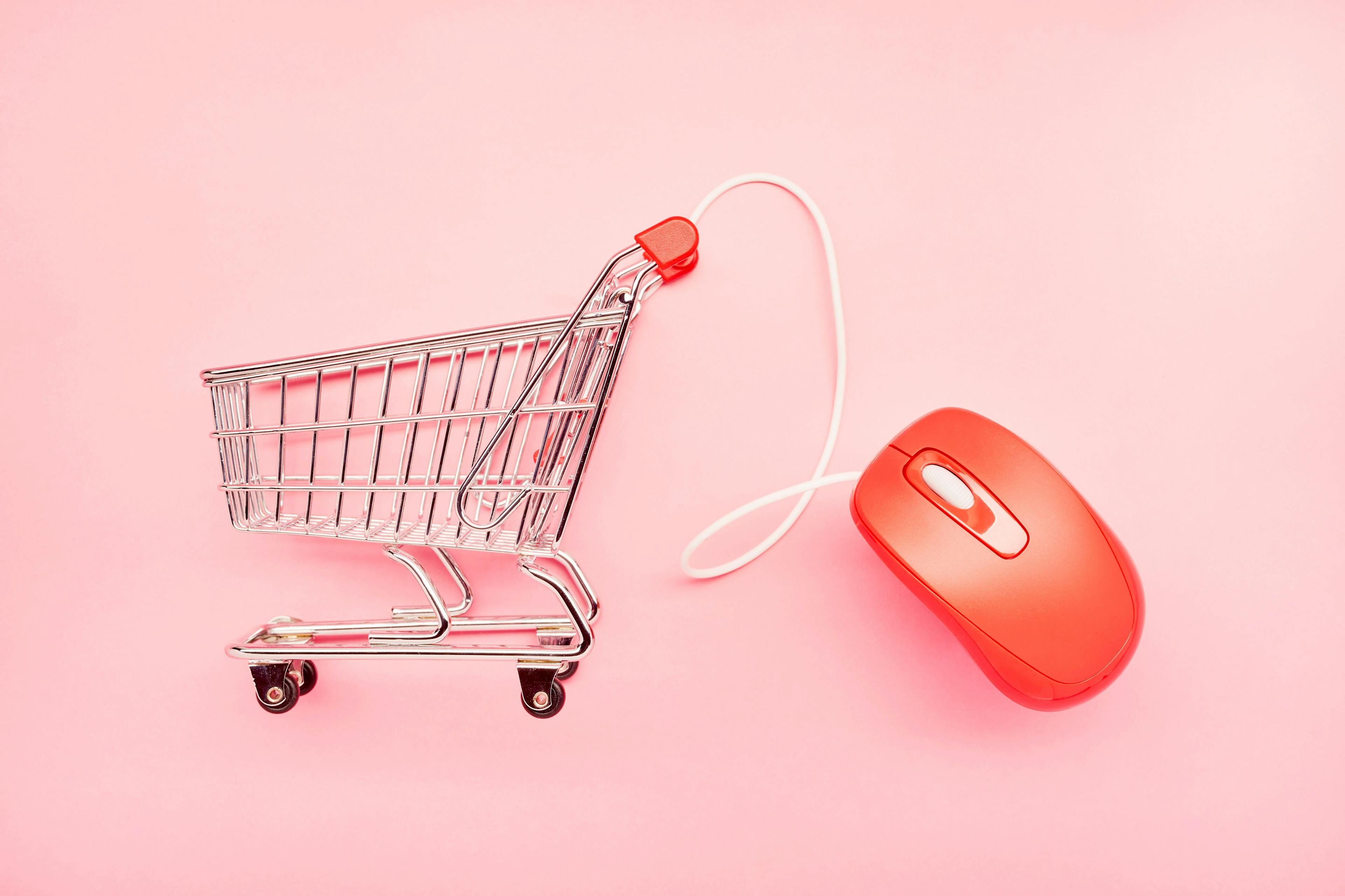 A grocery cart attached to a computer mouse. 